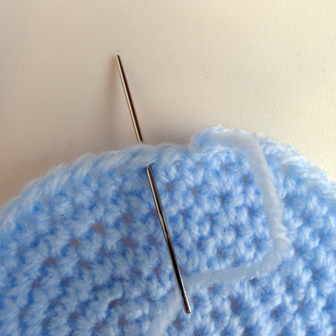 Thread yarn under stitch